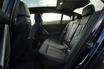 BMW i5 review (2023): rear seats, black faux leather upholstery