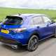Honda ZR-V (2023) review: rear three quarter driving, high angle, blue