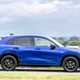 Honda ZR-V (2023) review: side view pan shot driving, blue