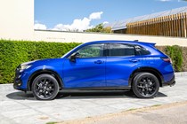Honda ZR-V (2023) review: side view static, blue, art gallery in background