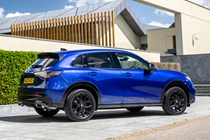 Honda ZR-V (2023) review: rear three quarter static, blue, art gallery in background