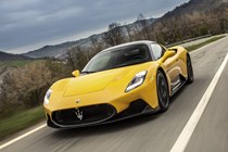 Maserati MC20 (2025) review: front three quarter driving, yellow paint, low angle