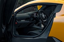 Maserati MC20 (2025) review: front seats and dashboard, through passenger door