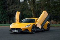 Maserati MC20 (2025) review: front three quarter static, yellow paint, doors open