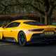 Maserati MC20 (2025) review: rear three quarter static, yellow paint