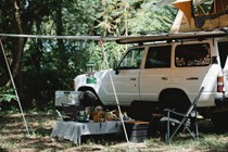 Off-road car with camp set up