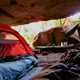 Tent and a sleeping bag in a cave