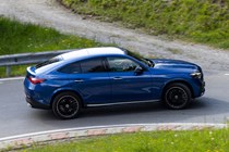 Mercedes GLC Coupe: side view cornering, blue paint, Alpine backdrop