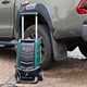 Bosch Fontus Pressure Washer next to pickup truck