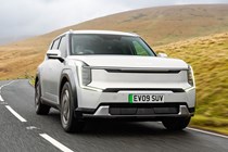 Kia EV9 review (2024): front three quarter driving, silver paint, British country road