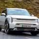 Kia EV9 review (2024): front three quarter cornering, silver paint, British country road