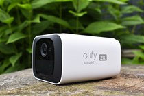 The Eufy S220 Solocam on wooden log