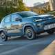 Dacia Spring review - front view, blue, driving in the UK