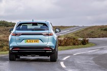 Honda e:Ny1 review - rear, blue, driving round corner