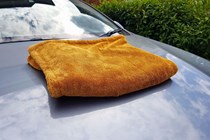 Drying towel on bonnet of Volvo