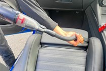 The Eufy H20 vacuuming a car seat