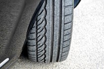 Car with tyre turned out - Guide to tyre checking