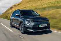 Most efficient electric cars: Kia Niro EV, front three quarter driving, grey paint