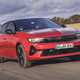 Vauxhall Astra Sports Tourer Electric (2023) review: front driving, British country lane, red paint