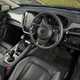 Subaru Crosstrek review (2024): driver's seat and steering wheel, black upholstery