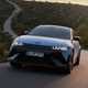 Hyundai Ioniq 5 N (2024) review: rear view driving, sunset shot matte blue paint, Spanish roads