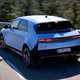 Hyundai Ioniq 5 N (2024) review: rear three quarter cornering, high angle, matte blue paint, Spanish roads