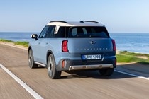 MINI Countryman Electric review - SE ALL4, rear, blue, driving