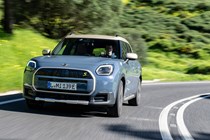 MINI Countryman Electric review - SE ALL4, front, blue, driving round corner