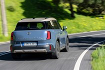 MINI Countryman Electric review - SE ALL4, rear, blue, driving round corner