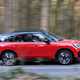 Mini Countryman Cooper SE in red, side profile
