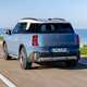 MINI Countryman Electric review - SE ALL4, rear, blue, driving