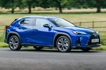 Lexus UX300h (2024) front three quarters driving