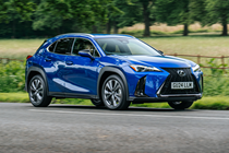 Lexus UX300h (2024) front three quarters driving