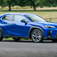 Lexus UX300h (2024) front three quarters driving