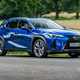 Lexus UX300h (2024) front three quarters driving