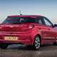 Hyundai i20 Hatchback (2015-) - UK rhd in red model, static exterior rear three-quarters Premium Nav 