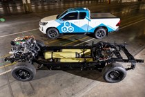 The future of fuel: Toyota Hilux hydrogen prototype, side view static, blue and white graphics, naked chassis showing hydrogen tech