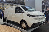 The future of fuel: Maxus eDeliver7, front three quarter static, white paint, on stand at the 2023 CV show