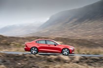 Volvo S60 Saloon (2019-) - UK rhd In red driving/action side-on