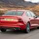 Volvo S60 Saloon (2019-) - UK rhd In red driving/action rear three-quarters
