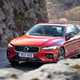 Volvo S60 Saloon (2019-) - UK rhd In red driving/action front three-quarters