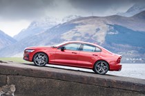 Volvo S60 Saloon (2019-) - T5 R-Design UK rhd model in red static exterior - side-on view