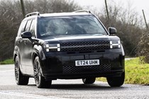 The best hybrid SUVs in 2025: Hyundai Santa Fe, front three quarter driving, black paint