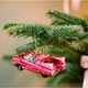 A selection of Christmas gifts on a red background