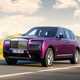 Rolls-Royce Cullinan (2024) review: front three quarter driving, purple paint