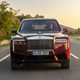 Rolls-Royce Cullinan (2024) review: front driving, red paint