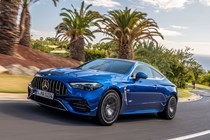 Mercedes-AMG CLE 53 review: front three quarter driving, low angle, palm trees in the background, blue paint