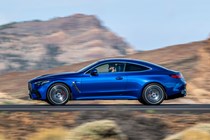 Mercedes-AMG CLE 53 review: side view driving, low angle, blue paint