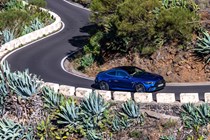 Mercedes-AMG CLE 53 review: front three quarter cornering, mountain pass, high angle, blue paint