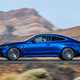 Mercedes-AMG CLE 53 review: side view driving, low angle, blue paint